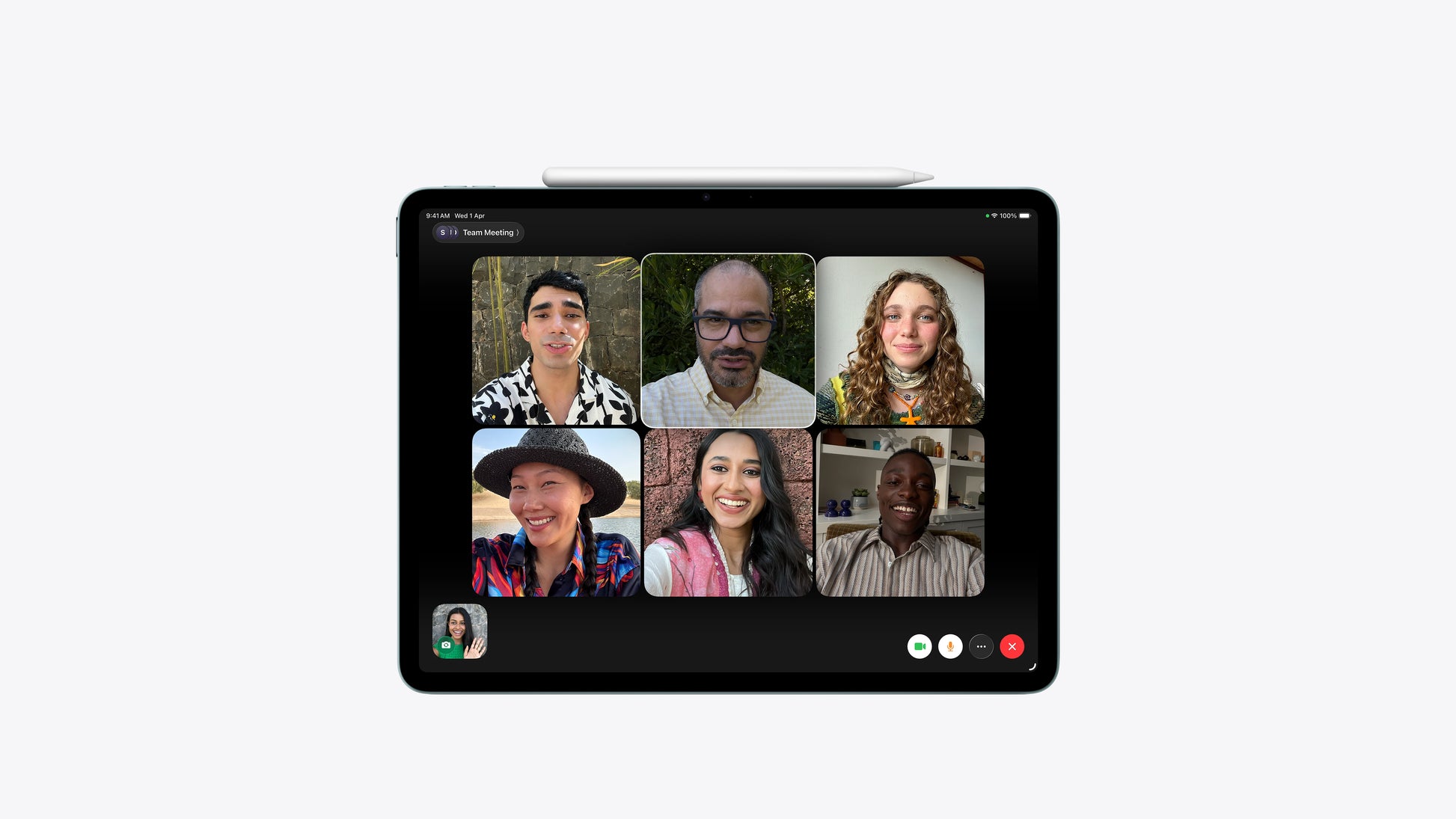 A black tablet device shown from the front on a light gray background, with a video call interface displaying six participants on screen.