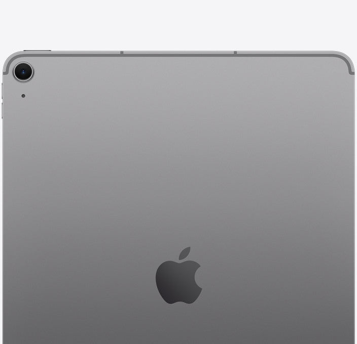 The back of a silver Apple iPad showing the rear camera lens and the Apple logo in the center, set against a plain light gray background.